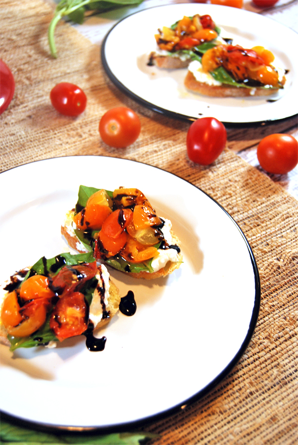 Grilled Cherry Tomato Salad Crostini with Whipped Burrata, Fresh Basil, and Balsamic Glaze: A quick 30 minute crostini! The classic flavor combination of cherry tomatoes, balsamic glaze, whipped burrata, and basil in an easy 2-bite appetizer!