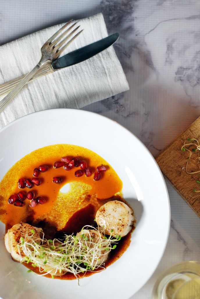 This delicious recipe for easy seared scallops is paired with a duo of beautifully refreshing pomegranate and carrot sauces.
