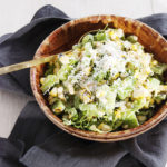 This refreshing roasted corn summer salad featured charred corn, grilled green peppers, and tons of fresh herbs and cheese all mixed together with a tangy Greek yogurt dressing.