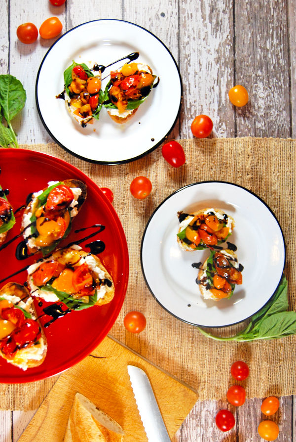 Grilled Cherry Tomato Salad Crostini with Whipped Burrata, Fresh Basil, and Balsamic Glaze: A quick 30 minute crostini! The classic flavor combination of cherry tomatoes, balsamic glaze, whipped burrata, and basil in an easy 2-bite appetizer!